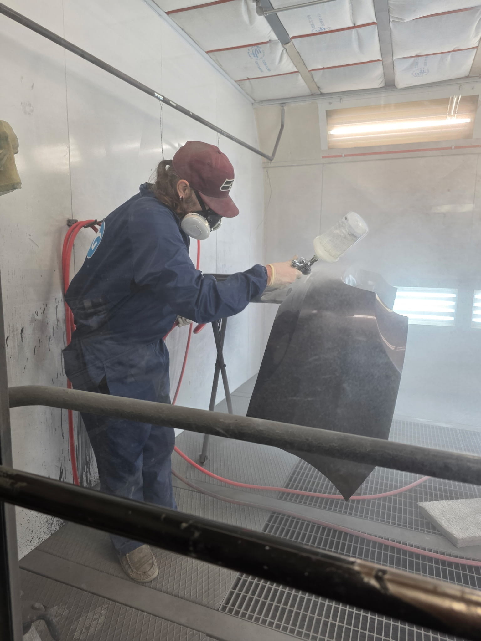 Our employee working in the paint shop.
